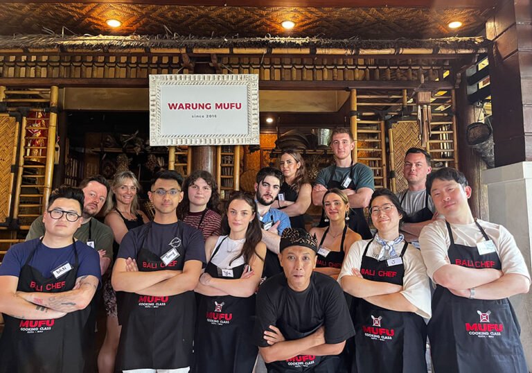 Family participating together in a beginner-friendly Balinese cooking class in Kuta