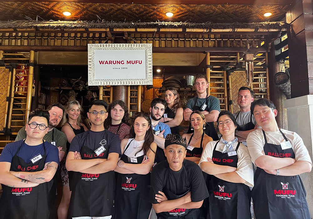 Family participating together in a beginner-friendly Balinese cooking class in Kuta