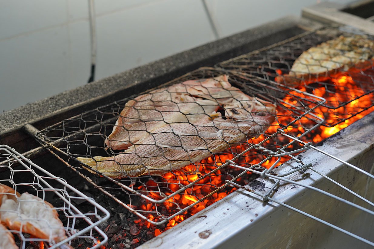 Grilled seafood prepared with Balinese spices in Kuta